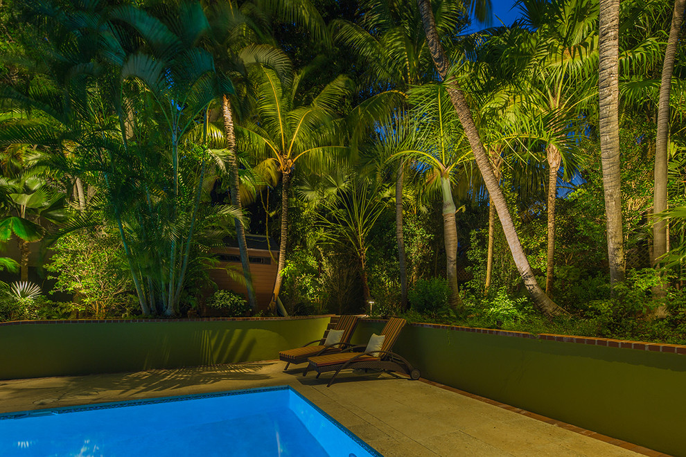 This is an example of a mid-sized tropical backyard landscaping in Miami.