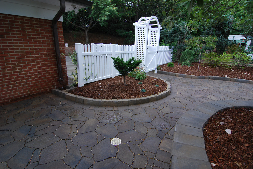 Inspiration for a small traditional partial sun backyard concrete paver landscaping in Charlotte.