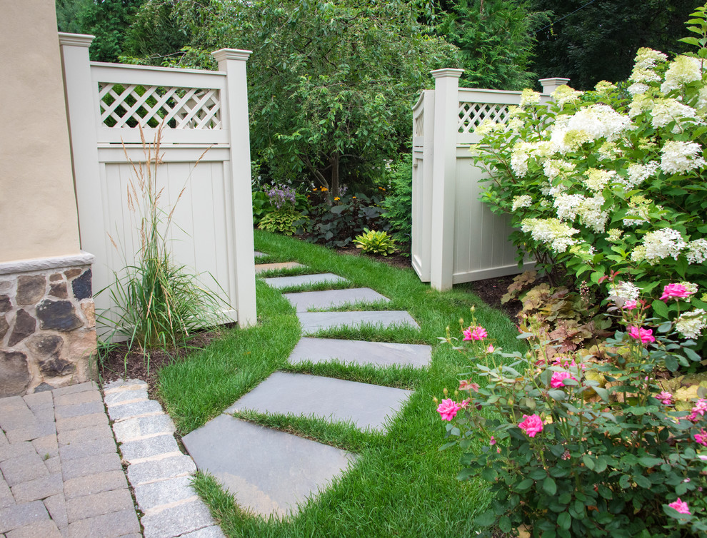 Design ideas for a traditional side yard concrete paver landscaping in New York.