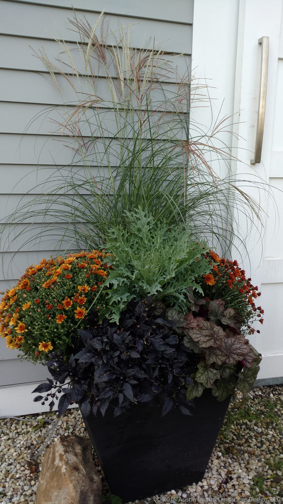 Traditional partial sun garden for autumn in New York with a potted garden.