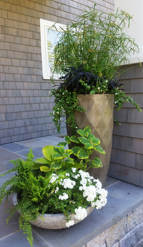 Inspiration for a mid-sized traditional front yard concrete paver landscaping in Portland Maine.