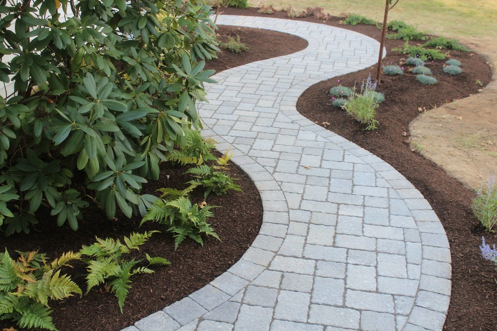 Design ideas for a mid-sized traditional partial sun front yard concrete paver garden path in New York for summer.