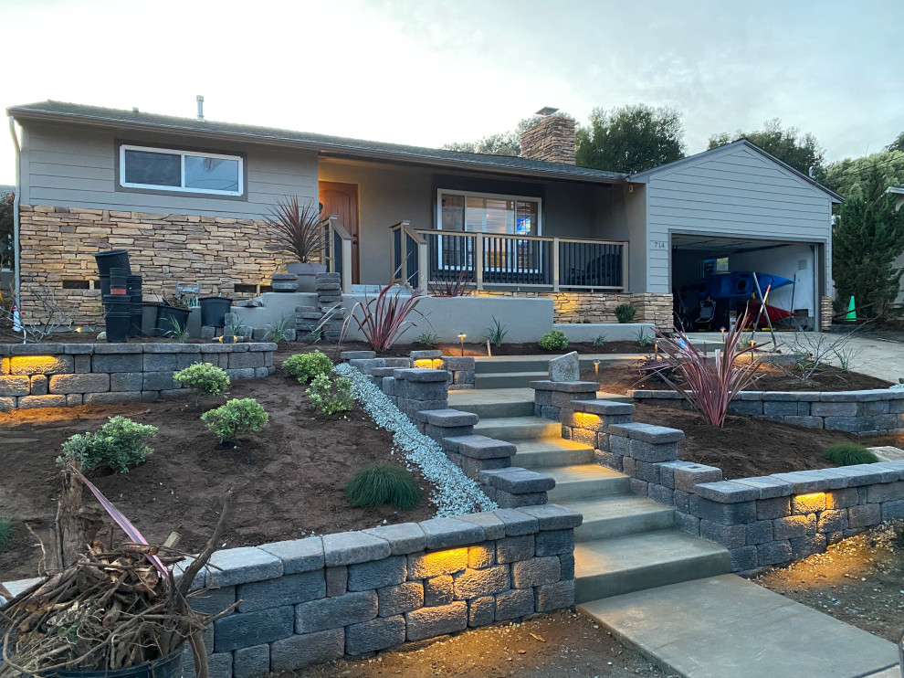 This is an example of a medium sized beach style front xeriscape garden in San Diego.