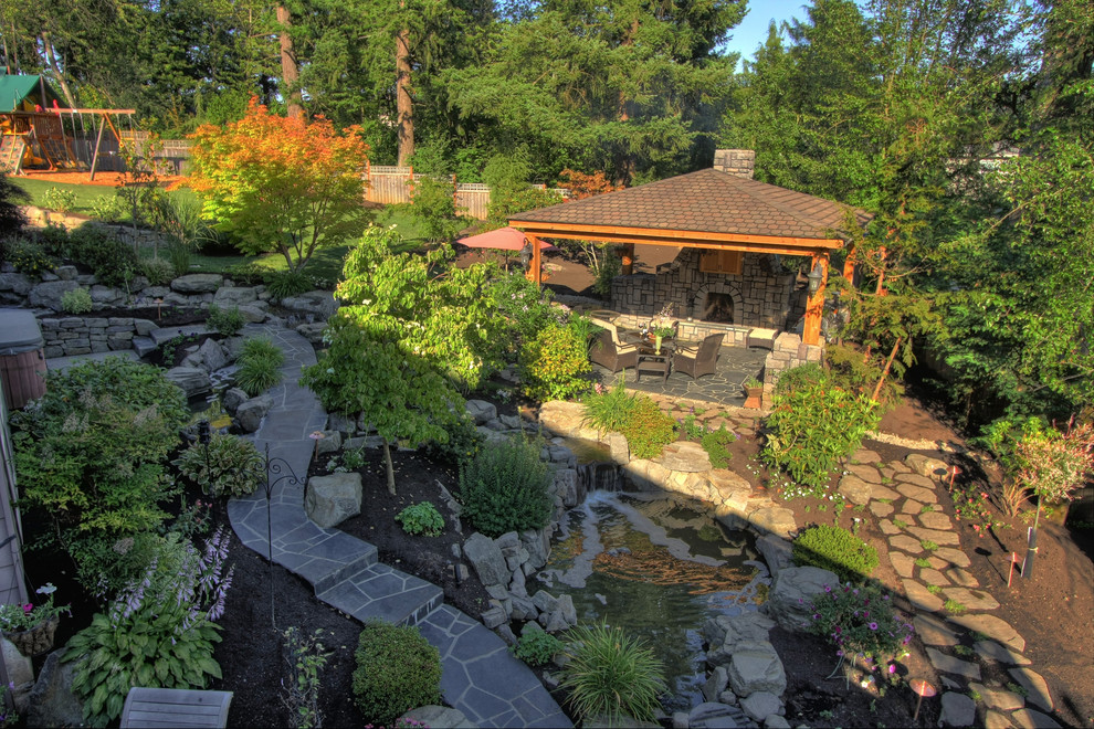 Design ideas for a rustic garden in Portland with a water feature.