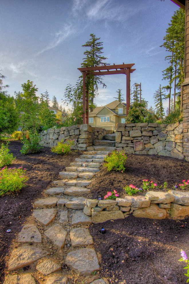 Design ideas for a traditional retaining wall landscape in Portland.