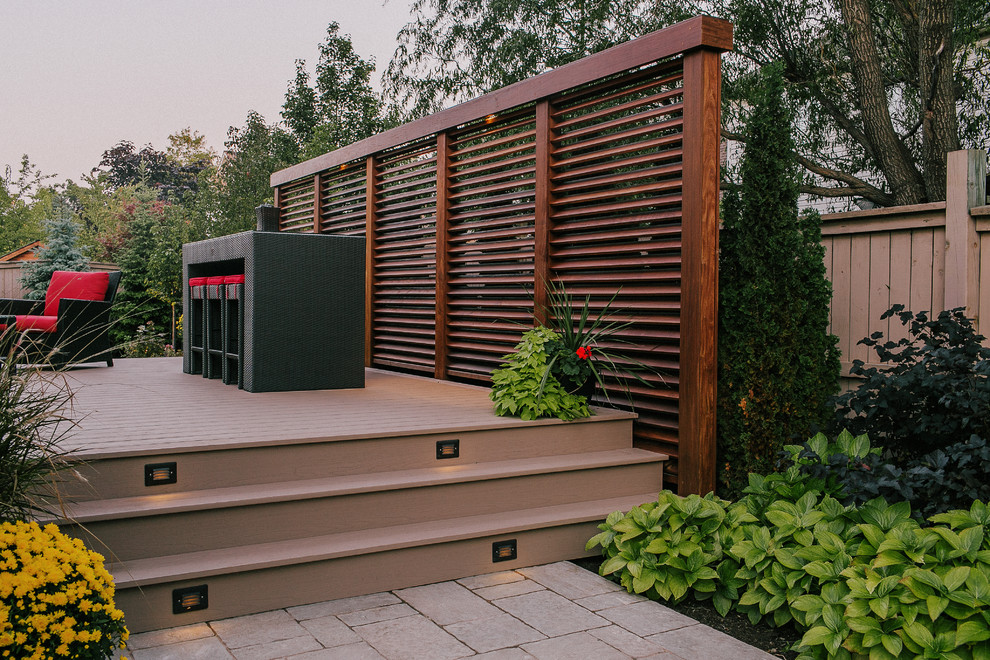 Photo of a medium sized classic back partial sun garden in Toronto with decking.