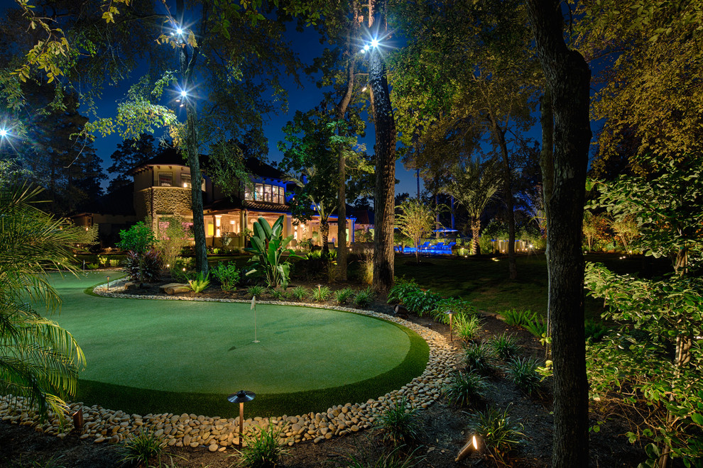 This is an example of a huge mediterranean backyard landscaping in Houston.