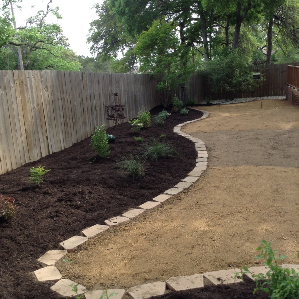 Photo of a small contemporary back xeriscape partial sun garden for summer in Austin with decking.