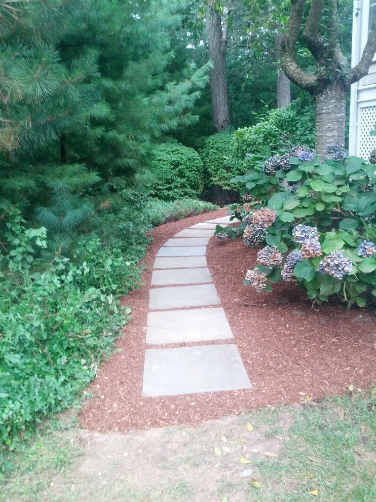 Design ideas for a large shade side yard concrete paver garden path in Boston.