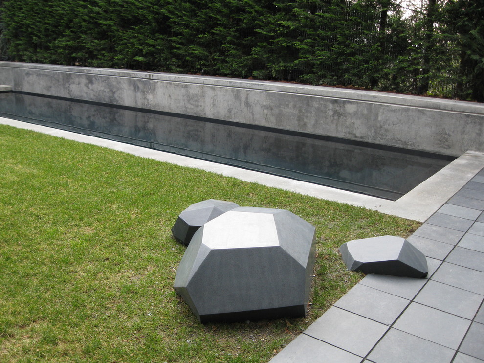 Inspiration for a contemporary shade backyard stone water fountain landscape in Seattle.