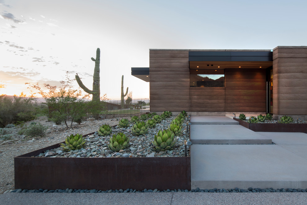 Contemporary xeriscape garden in Phoenix with a desert look.