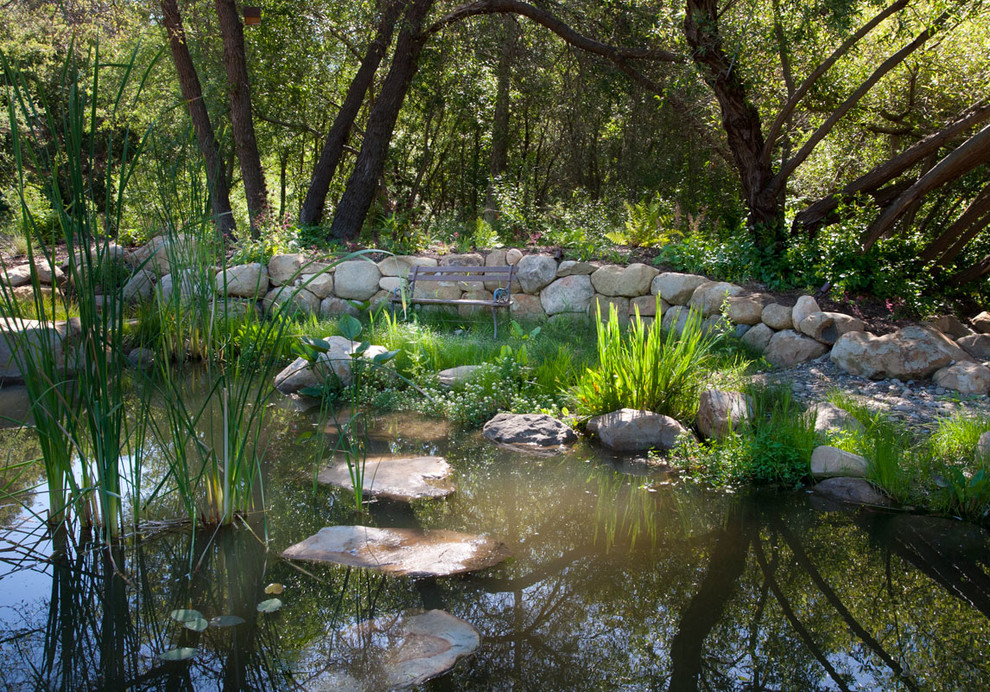 Photo of a farmhouse garden in Santa Barbara with a water feature.