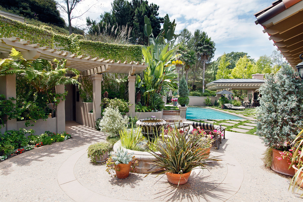 Inspiration for a traditional courtyard landscaping in San Diego with a pergola.