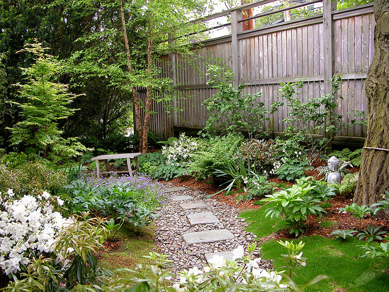 Design ideas for a mid-sized asian full sun backyard stone garden path in Boston for spring.