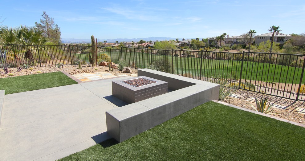 Inspiration for a large traditional drought-tolerant and full sun backyard concrete paver landscaping in Las Vegas with a fire pit.