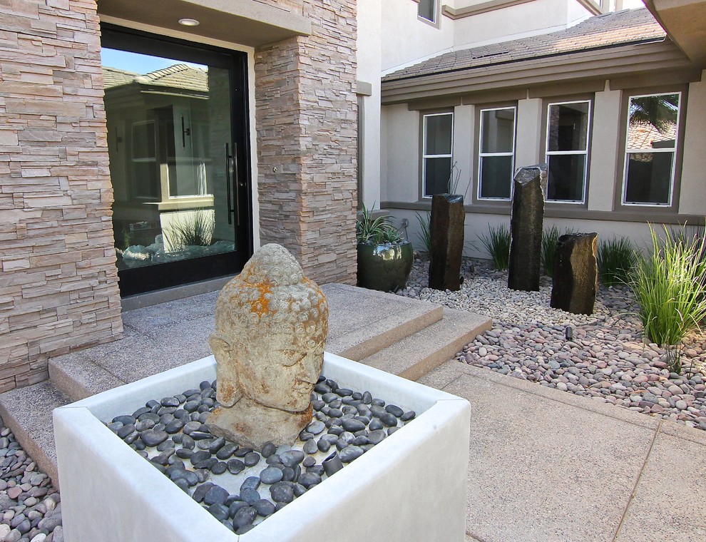 This is an example of a huge traditional drought-tolerant and partial sun front yard gravel garden path in Las Vegas.