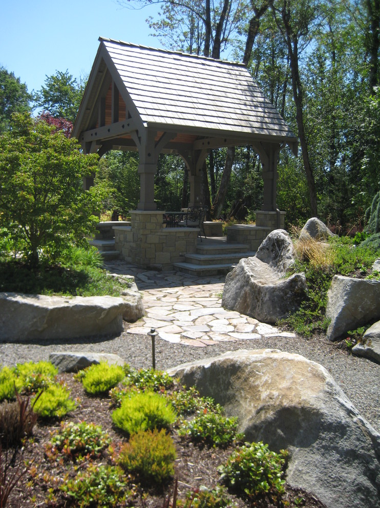 Photo of a traditional backyard stone landscaping in Burlington.