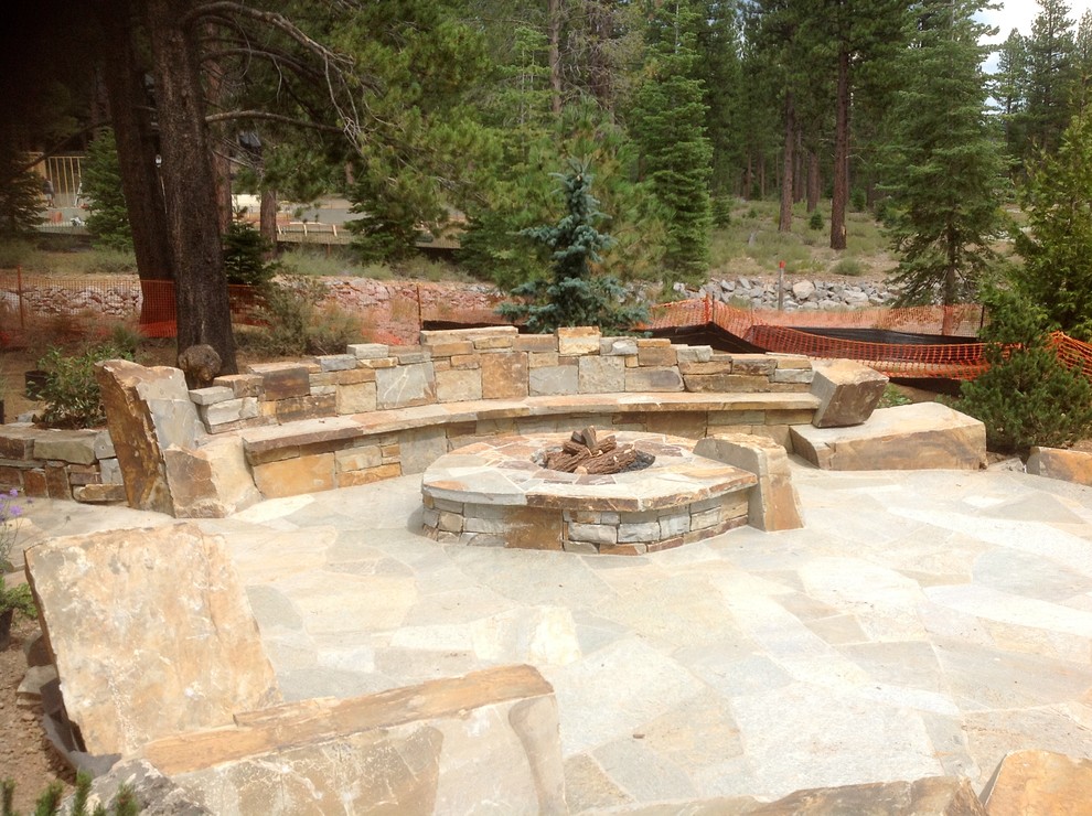 Inspiration for a medium sized classic back patio in San Francisco with a fire feature and natural stone paving.