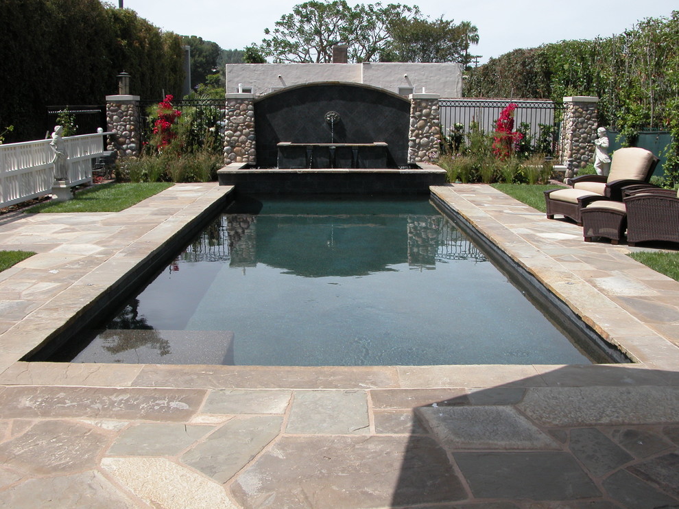 Design ideas for a coastal swimming pool in San Diego with a water feature.