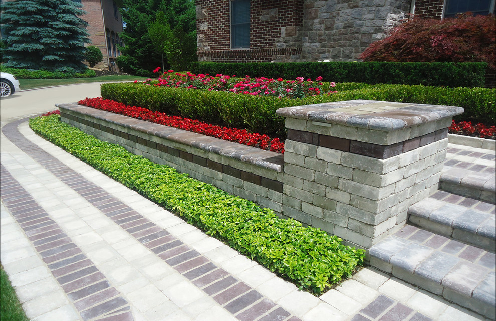 This is an example of a large contemporary partial sun front yard brick landscaping in Detroit for summer.