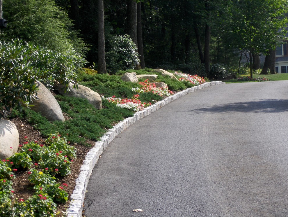 Inspiration for a mid-sized traditional full sun front yard stone garden path in Boston for spring.