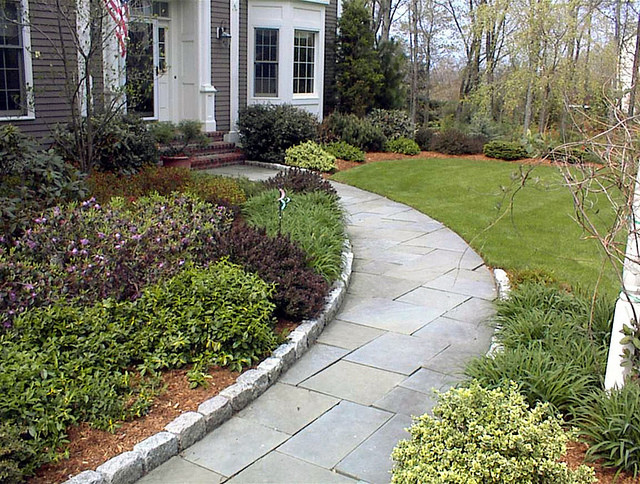 Inspiration for a mid-sized traditional front yard stone garden path in Boston.