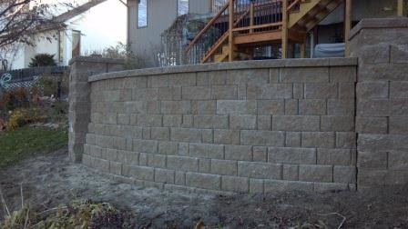 Inspiration for a traditional garden in Omaha with a retaining wall.