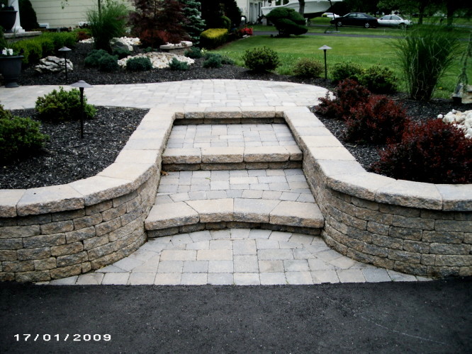 Classic garden in New York with natural stone paving.