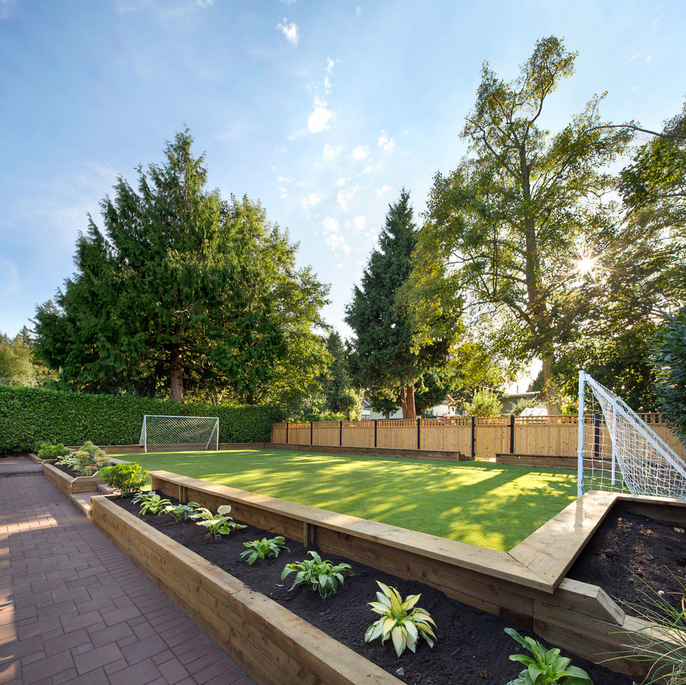 This is an example of a transitional partial sun backyard brick outdoor sport court in Vancouver.