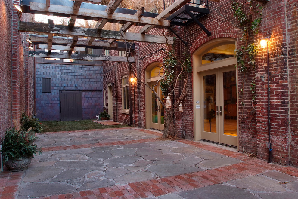Design ideas for an eclectic courtyard landscaping in Philadelphia with a pergola.