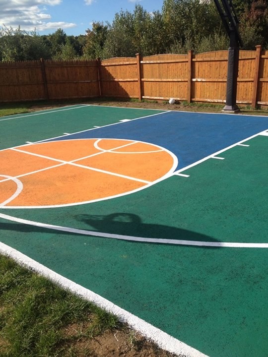Photo of a large traditional partial sun backyard outdoor sport court in Boston.