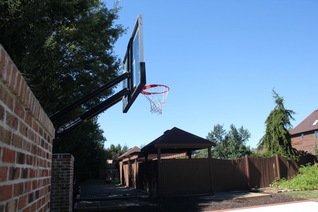 This is an example of a large traditional partial sun backyard outdoor sport court in Philadelphia.