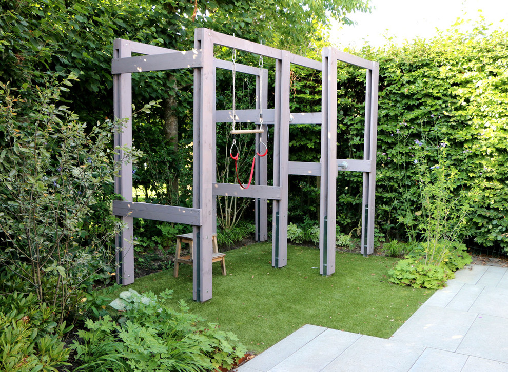 Inspiration for a contemporary back fully shaded garden for spring in Amsterdam with an outdoor sport court and decking.