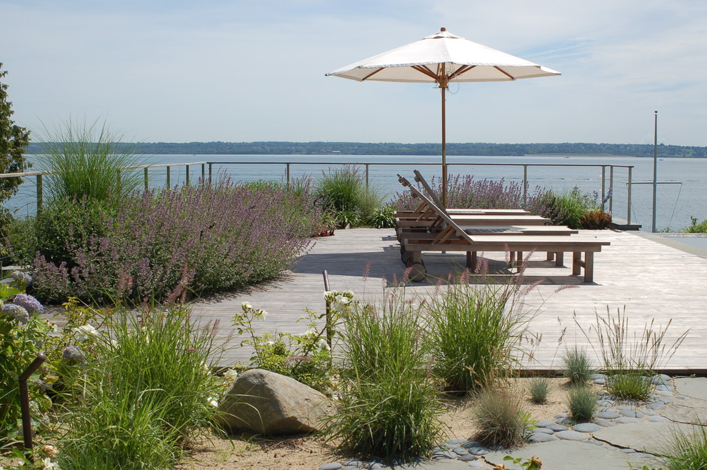 Photo of a traditional garden in Providence with decking.