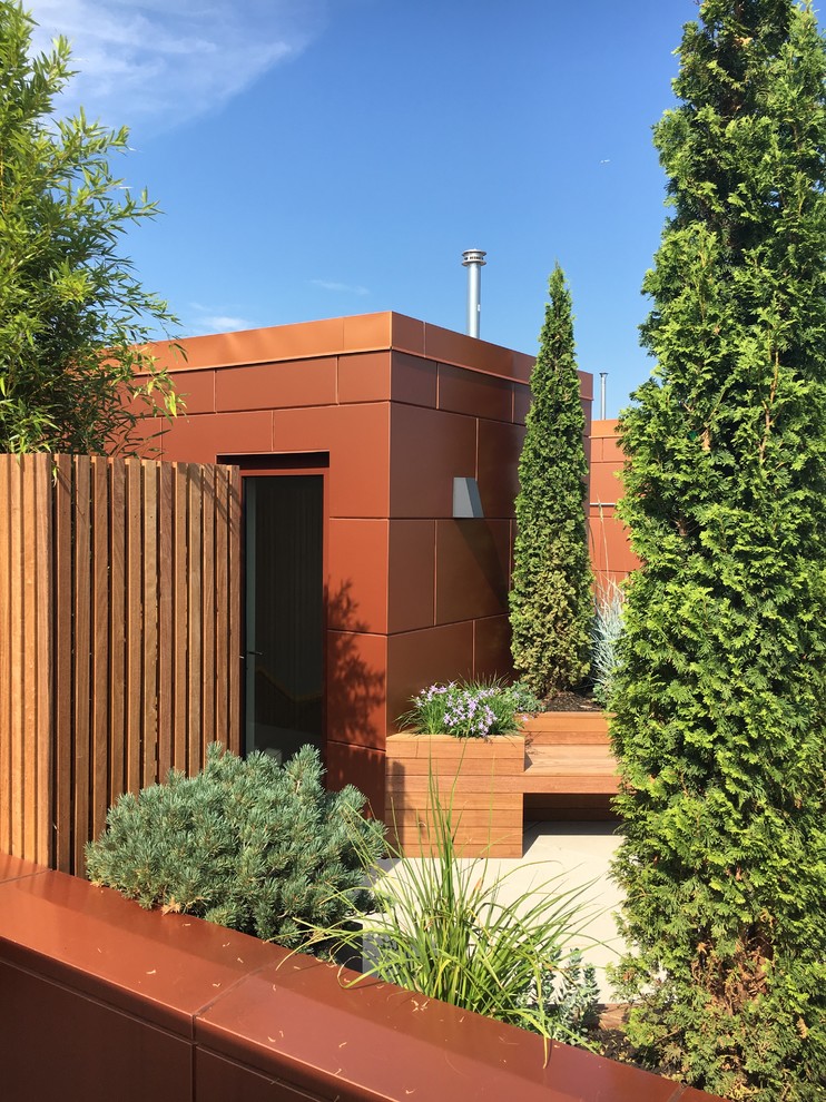 Inspiration for a mid-sized modern concrete paver landscaping in New York.
