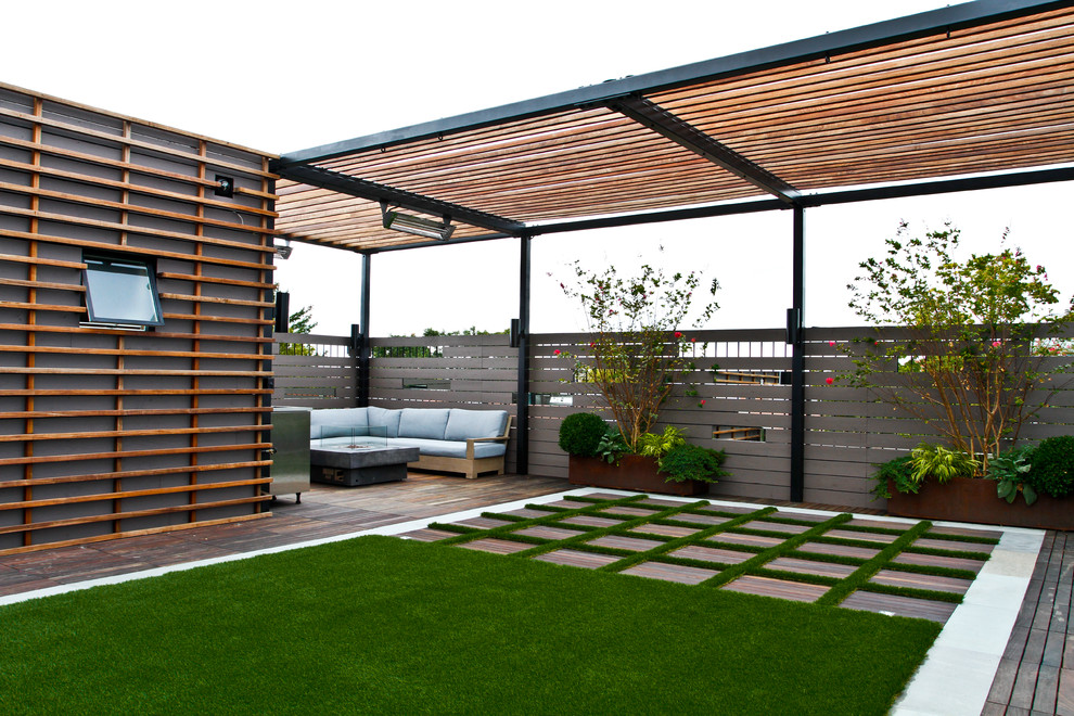 Design ideas for a large modern partial sun rooftop landscaping in New York with a fire pit for summer.