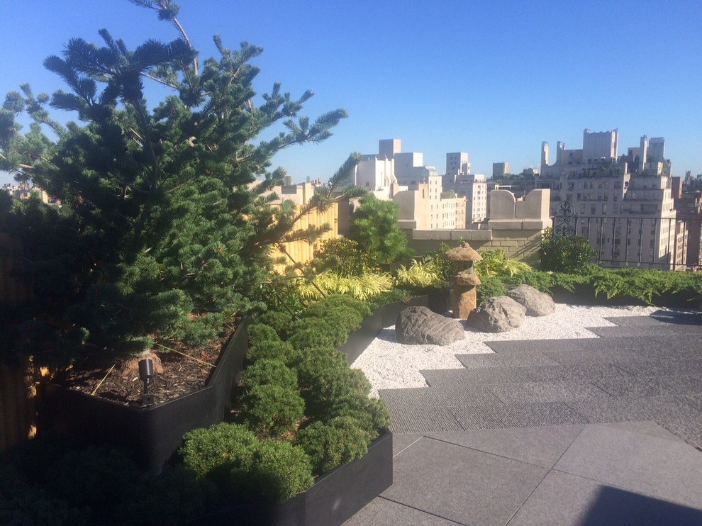 Inspiration for a mid-sized asian full sun rooftop gravel formal garden in New York.