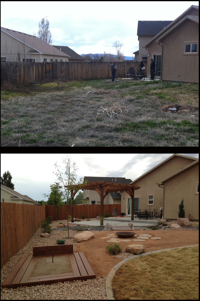 Design ideas for a mid-sized full sun backyard gravel landscaping in Denver.