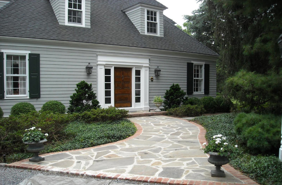Inspiration for a medium sized country front driveway fully shaded garden for spring in New York with natural stone paving and a garden path.
