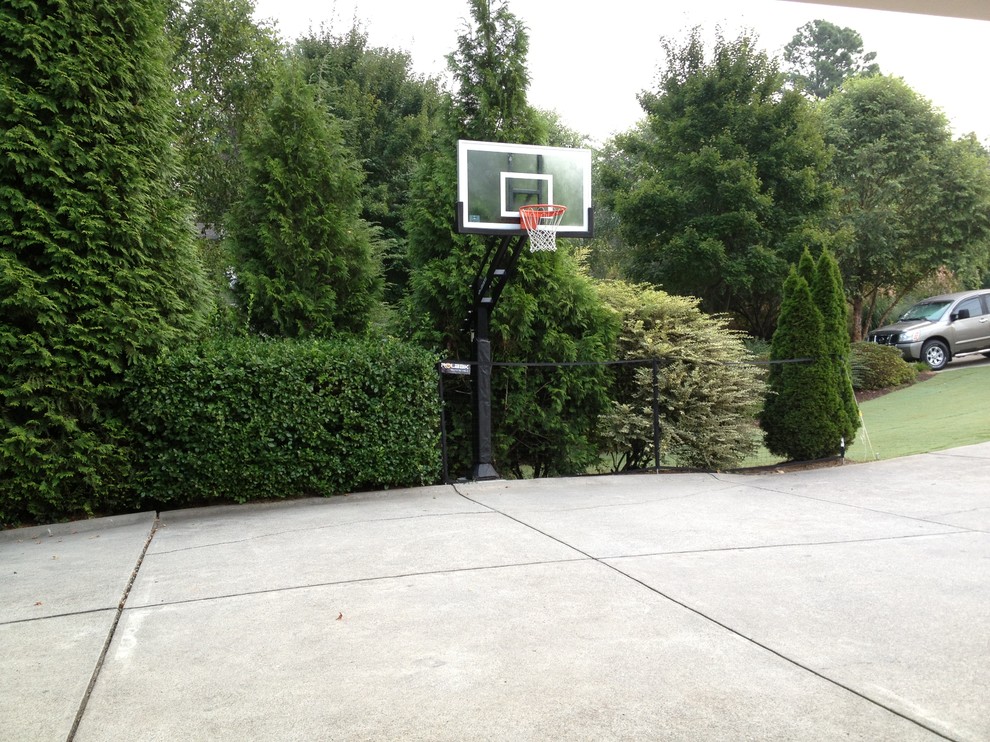 Inspiration for a large traditional front partial sun garden in Atlanta with an outdoor sport court.