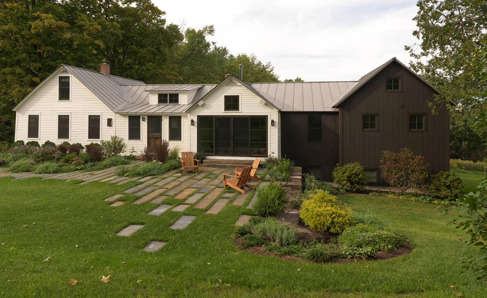 Idée de décoration pour un jardin design de taille moyenne avec des pavés en pierre naturelle.