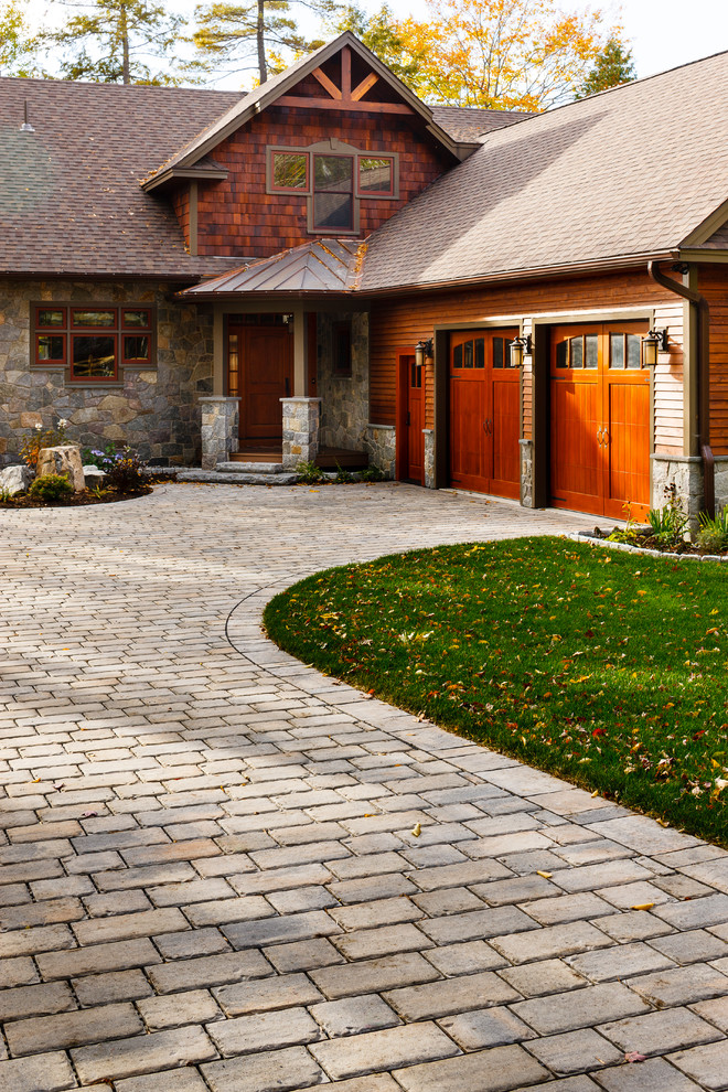 Design ideas for a large rustic front yard driveway in Other.