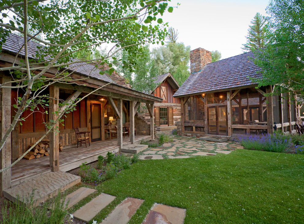Photo of a rustic courtyard garden in Other with natural stone paving.