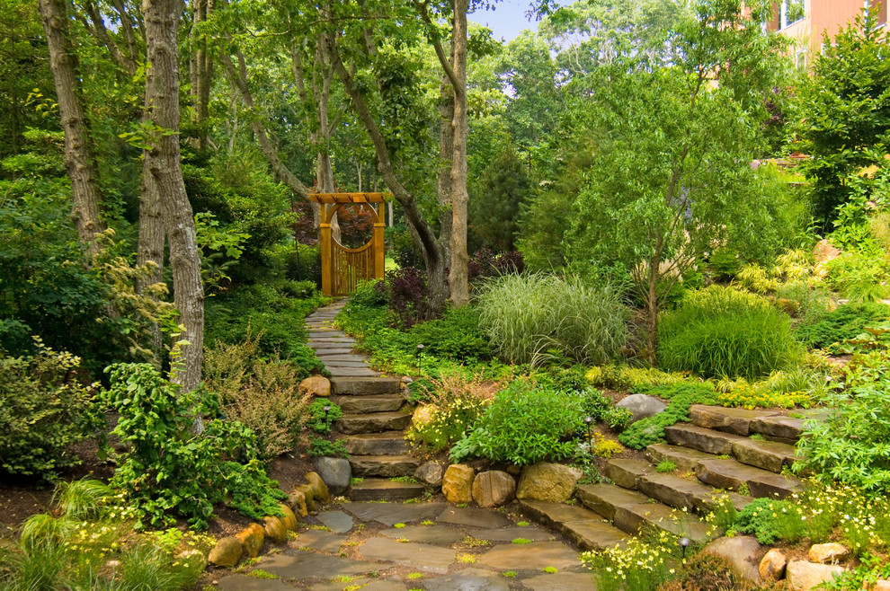 Rustic back fully shaded garden steps in New York with natural stone paving.