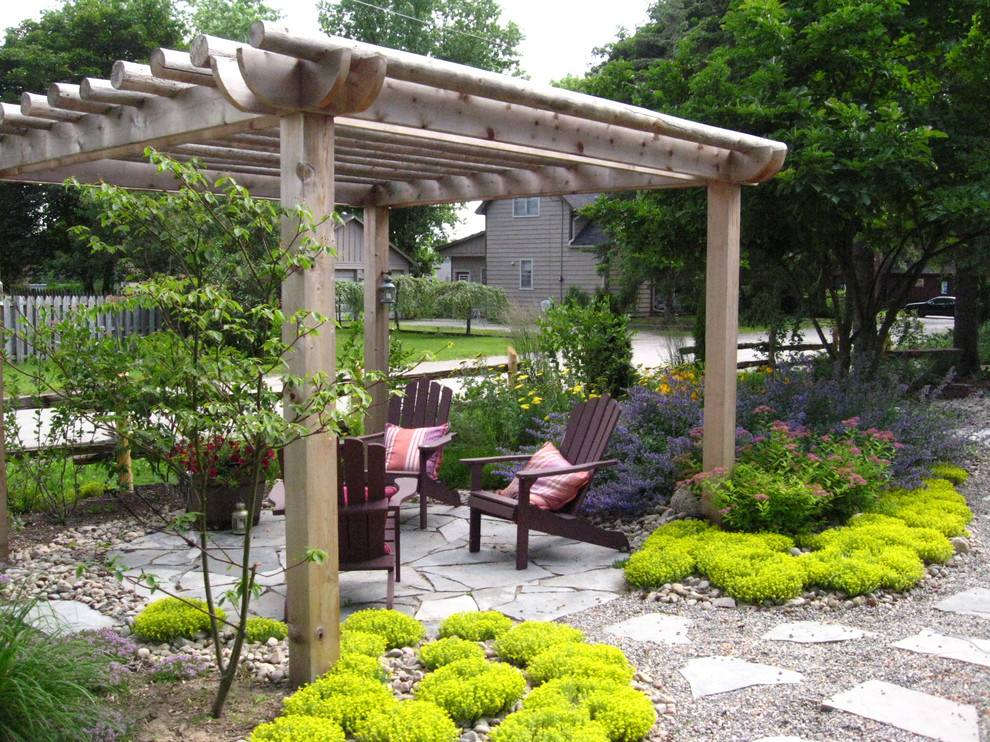 Design ideas for a classic garden seating for summer in Toronto with natural stone paving.