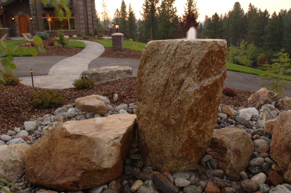 Inspiration for a large southwestern backyard stone landscaping in Seattle.