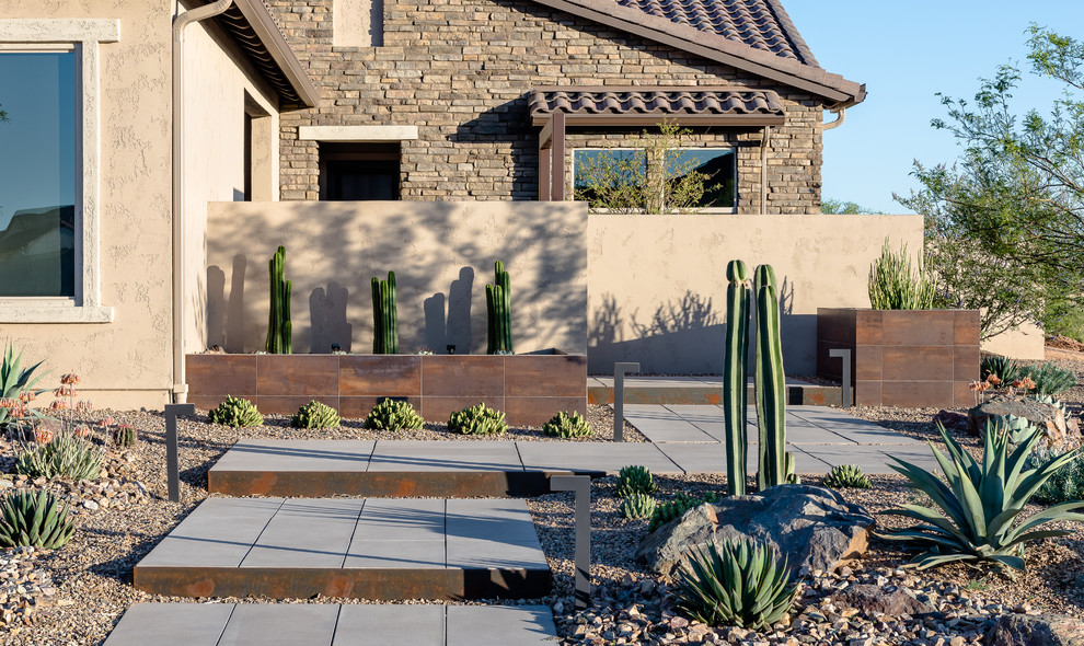 Design ideas for a mid-sized contemporary drought-tolerant and full sun front yard concrete paver landscaping in Phoenix.