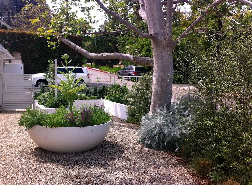 Idee per un orto in giardino design esposto a mezz'ombra davanti casa con ghiaia