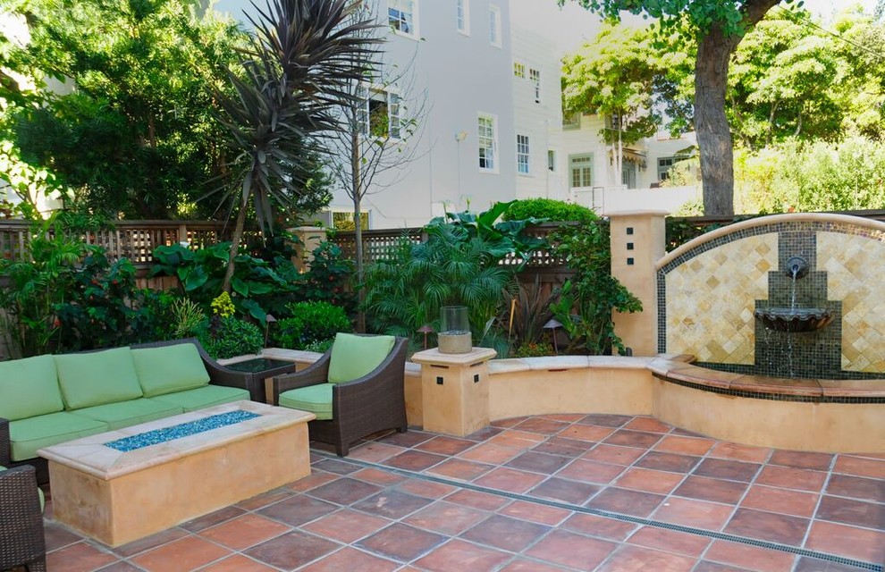 Small tuscan backyard patio photo in San Francisco with a fire pit