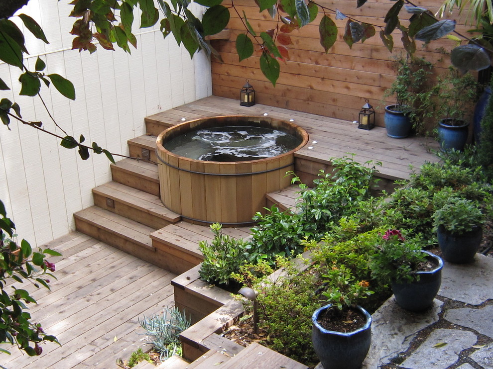Photo of a contemporary back formal partial sun garden in San Francisco with a water feature and decking.